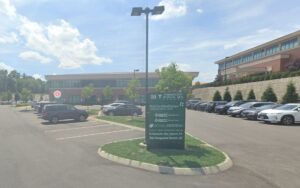 Exterior of the Natural Dentistry office building and parking lot on Birdseye Road in Farmington